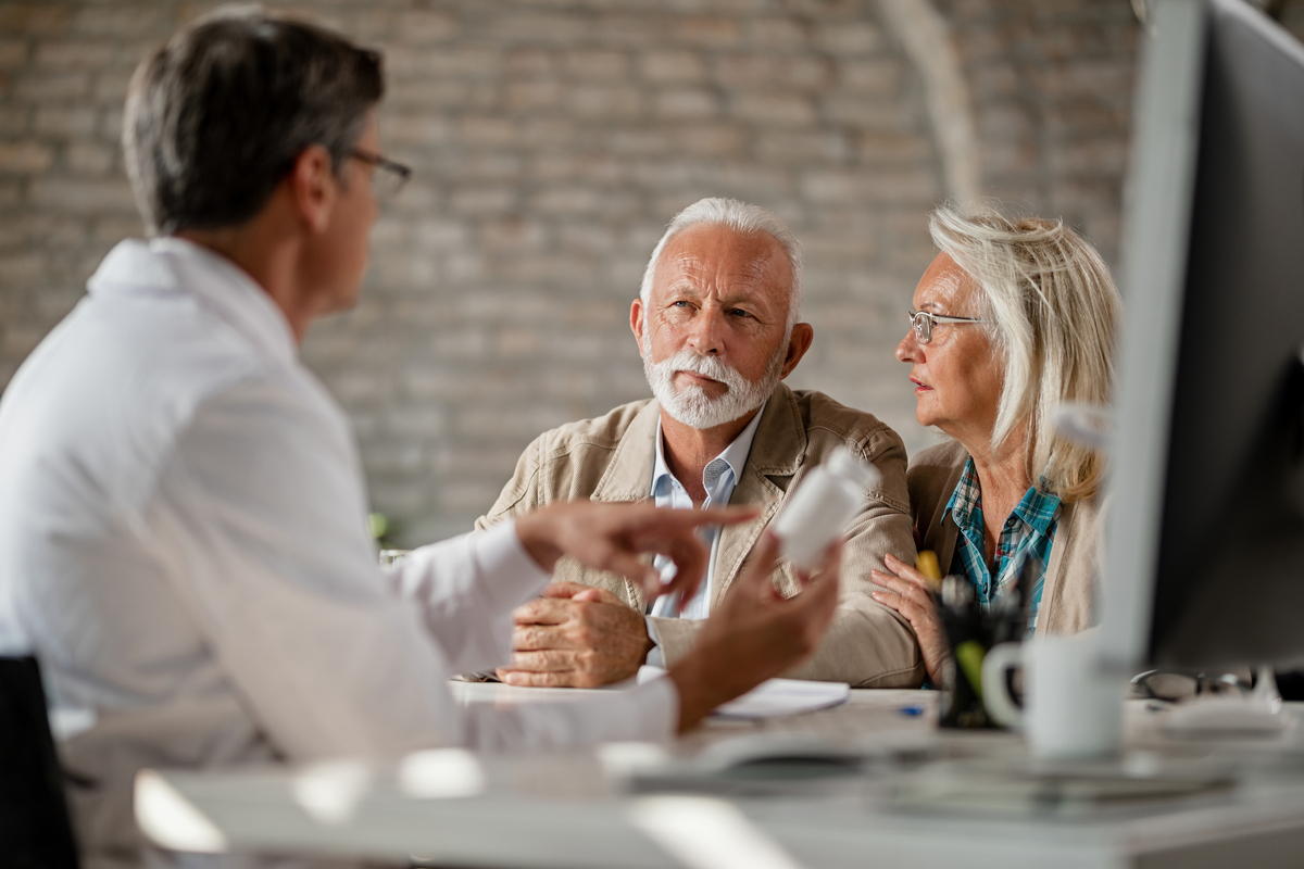 Couple listening to Medicare Advantage vs Medicare Supplement