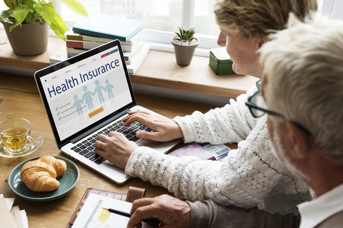 Couple looking at health insurance and long term care plans